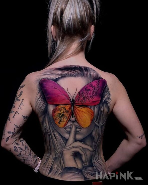 Tattoo Motyl na twarzy in faces motif and realistic style on the back