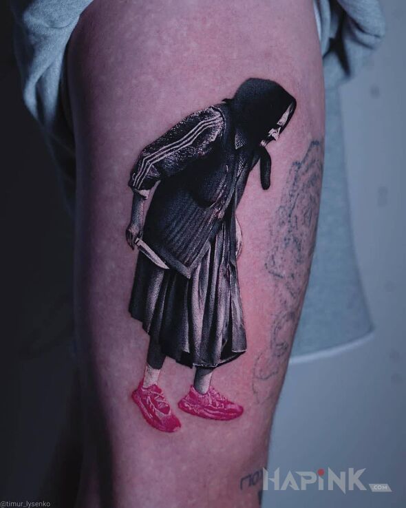 Tattoo Babka z nożem in funny motif and realistic style on the thigh