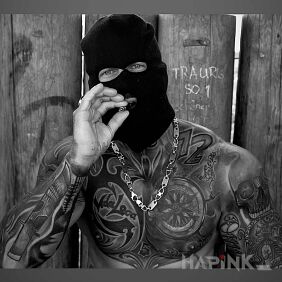 Tattoo Thug on the forearm motif: black and gray style: realistic