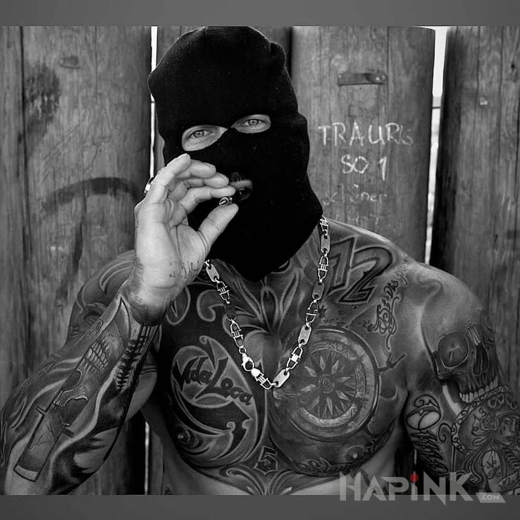 Tattoo Bandzior in skulls motif and tribal style on the chest