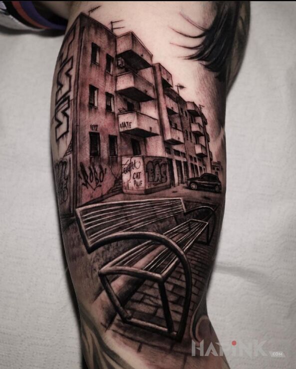 Tattoo Ławeczka in black and gray motif and realistic style on the bicep