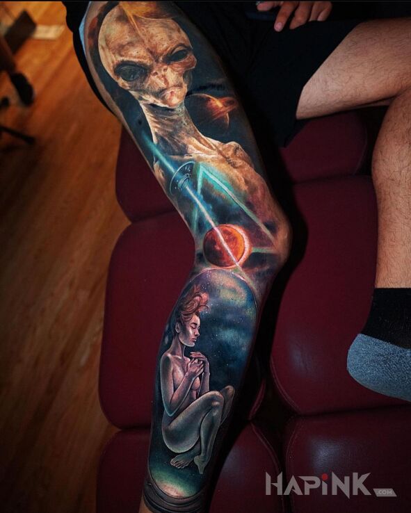 Tattoo Kosmita in characters motif and realistic style on the thigh