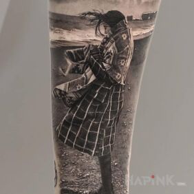 Tattoo Girl on the Beach On the arm motif: characters style: realistic