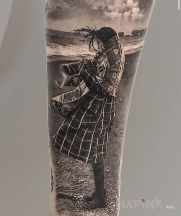 Tattoo Dziewczyna na plaży in black and gray motif and realistic style On the arm