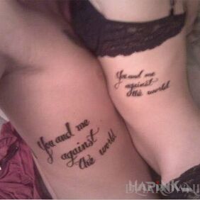 Tattoo You and me against the world on the ribs motif: lettering