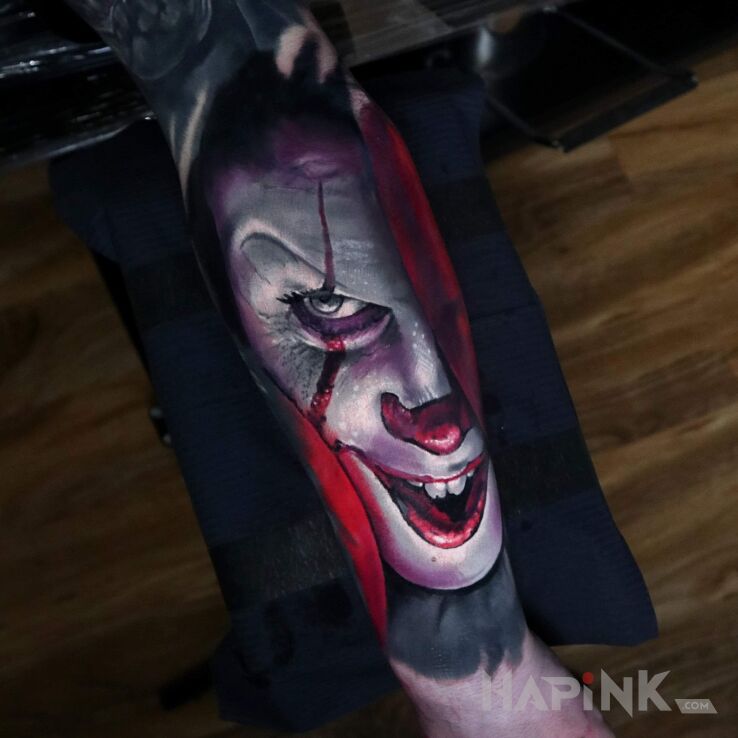Tattoo Film in faces motif and realistic style on the forearm