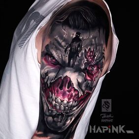 Tattoo Joker on the upper arm motif: dark style: realistic