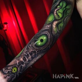 Tattoo Green Eye on the forearm motif: dark style: organic