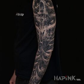 Tattoo Fangs and spikes on the forearm motif: black and gray style: organic