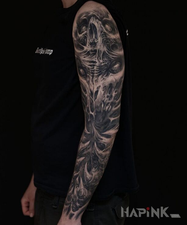 Tattoo Kły i kolce in black and gray motif and organic style on the forearm