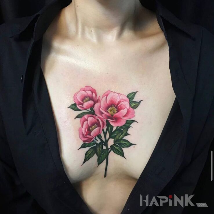 Tattoo 3 kolorowe kwiaty in colorful motif and realistic style on the breast