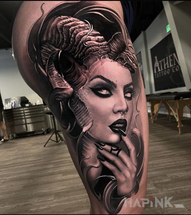 Tattoo Rogata diablica in black and gray motif and realistic style on the buttocks
