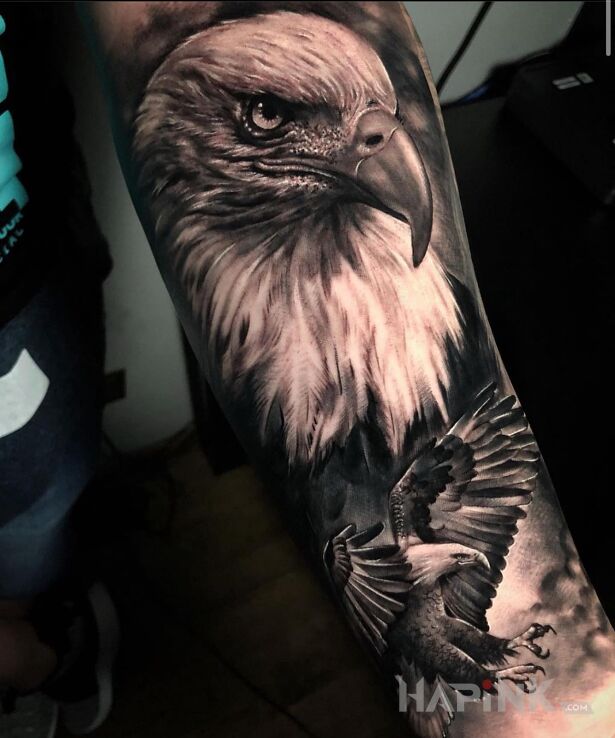 Tattoo Dumny orzel in black and gray motif and realistic style on the forearm