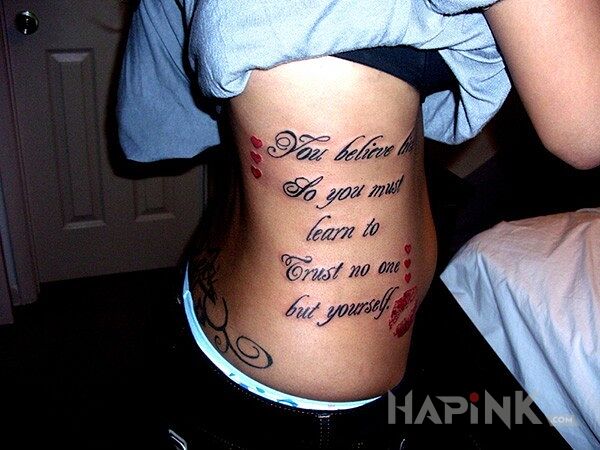 Tattoo Coś o zaufaniu  in lettering motif on the ribs