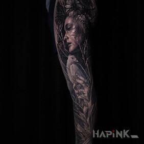 Tattoo Girl with a bird in her hands on the calf motif: faces style: realistic