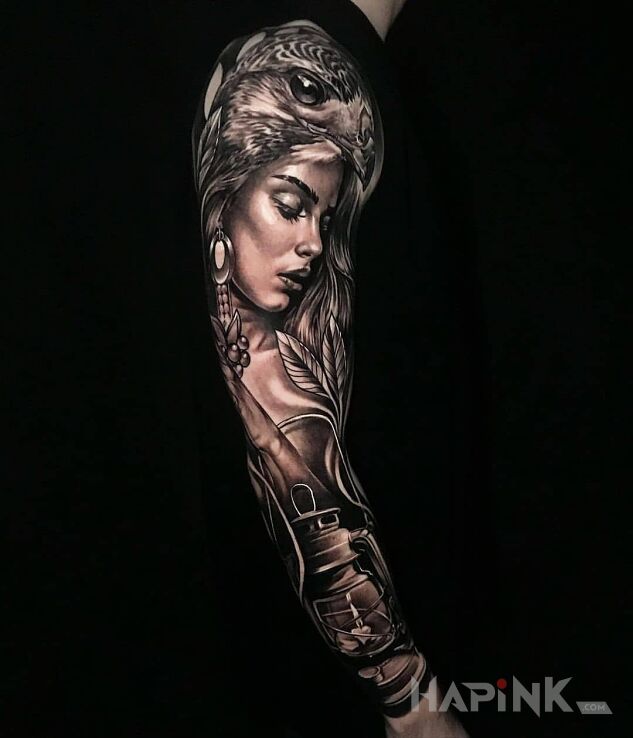 Tattoo Kobiecina na czarnym tle in faces motif and realistic style On the arm