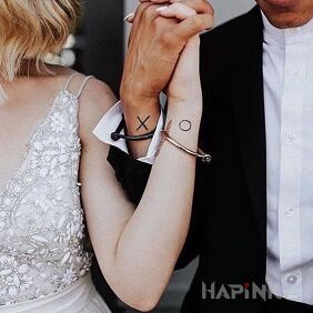 Tattoo Circle and cross on the wrist motif: Love