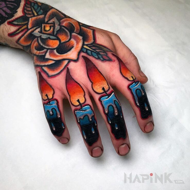 Tattoo Świece w intensywnych kolorach in objects motif and newschool style on the hand