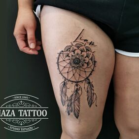 Tattoo Mandala dreamcatcher on the leg motif: Indian style: graphic / illustrative