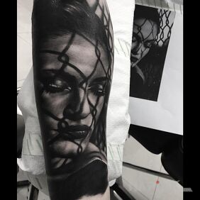 Tattoo Realistic portrait on the forearm motif: 3D style: realistic