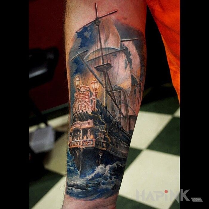 Tattoo Okret in realistic style on the forearm
