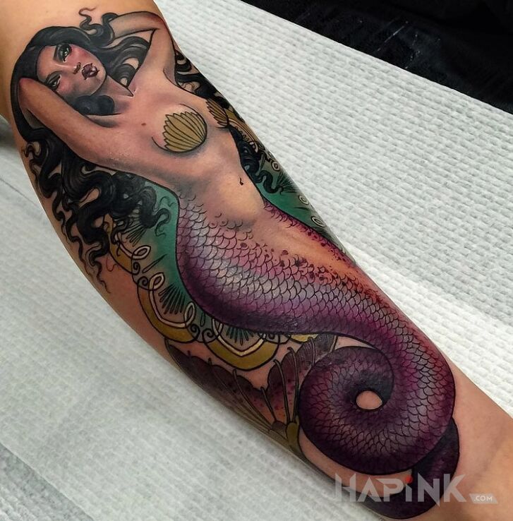 Tattoo Syrena in characters motif on the forearm
