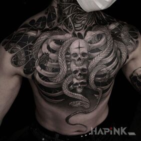 Tattoo Snakes in the ribs on the shoulder motif: black and gray style: realistic