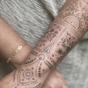 Tattoo Elegant hand On the arm motif: black and gray style: graphic / illustrative