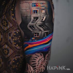 Tattoo Block in a crooked mirror on the upper arm motif: colorful style: surrealistic