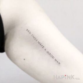 Tattoo Bad times, but a good man on the bicep motif: lettering