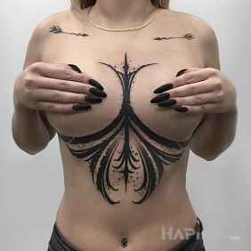 Tattoo Smeared in black between the breasts motif: black and gray style: blackwork / blackout
