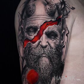 Tattoo Norse deity on the upper arm motif: ripped skin style: realistic