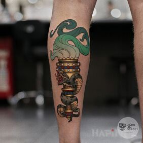 Tattoo Torch with a snake on the leg motif: objects style: neo-traditional