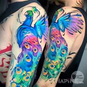 Tattoo Peacock on the upper arm motif: colorful style: Watercolor