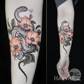 Tattoo Snake On the arm motif: colorful style: realistic
