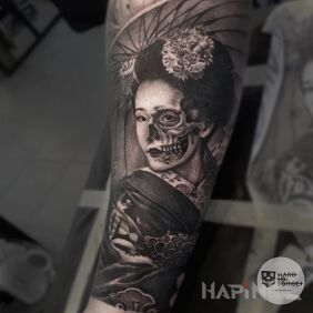 Tattoo Geisha on the forearm motif: black and gray style: realistic
