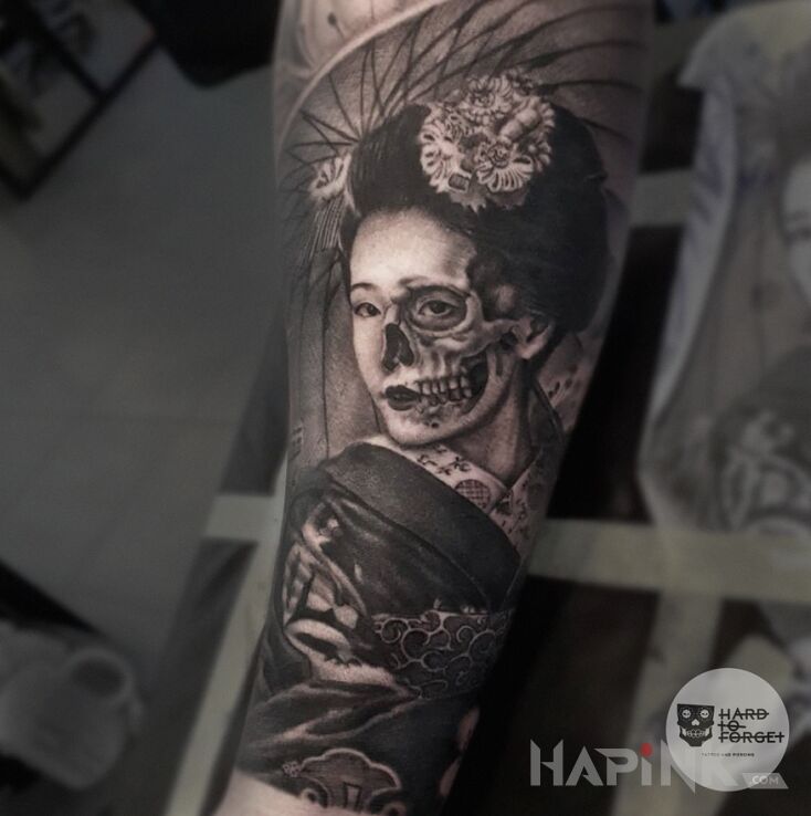 Tattoo Gejsza in faces motif and realistic style on the forearm