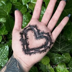 Tattoo Heart of barbed wire On the arm motif: black and gray style: graphic / illustrative