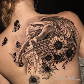 Tattoo Angel's Despair on the shoulder blades motif: flowers style: realistic