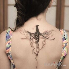 Tattoo Smoky bird on the back motif: other style: graphic / illustrative