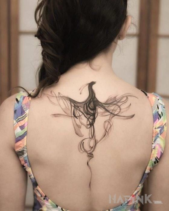 Tattoo Zadymiony ptak in black and gray motif and graphic / illustrative style on the back