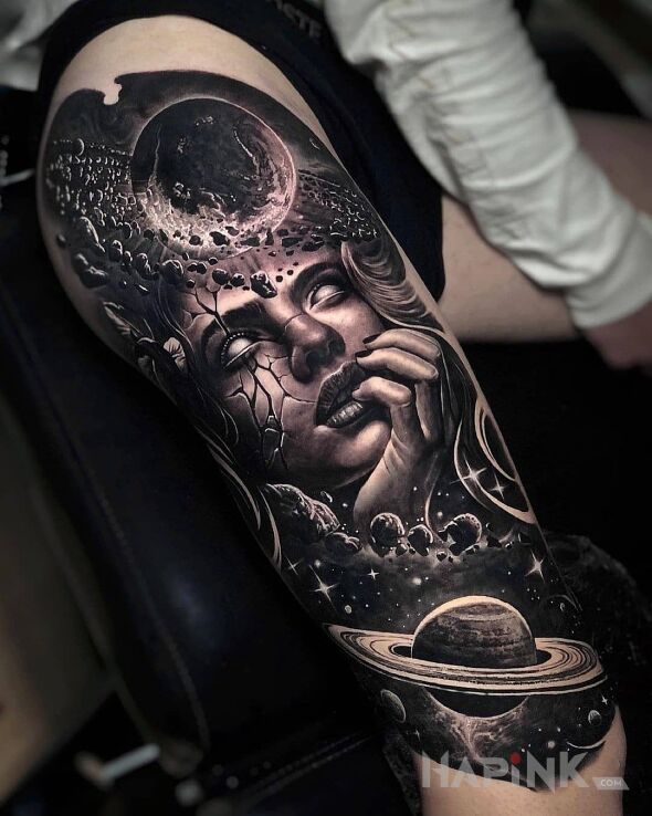Tattoo Dziołcha w kosmosie in black and gray motif and realistic style on the thigh