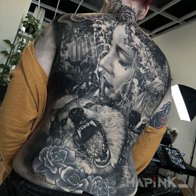 Tattoo Fierce wolf / calm girl on the shoulder blades motif: animals style: realistic