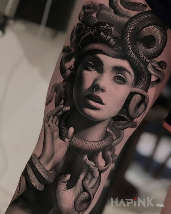 Tattoo Meduza na miarę naszych czasów in black and gray motif and realistic style on the forearm