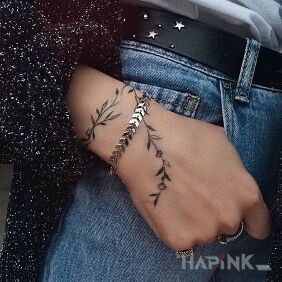 Tattoo Tiny tiny branch on the hand motif: black and gray style: minimalistic