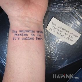 Tattoo Fear on the wrist motif: lettering
