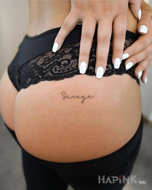 Tattoo Savage in lettering motif and calligraphy style on the buttocks
