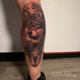 Tattoo Wolf on the leg motif: animals style: realistic