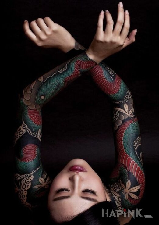 Tattoo Wąż rozciągnięty na dwie ręce in colorful motif and japanese / irezumi style On the arm