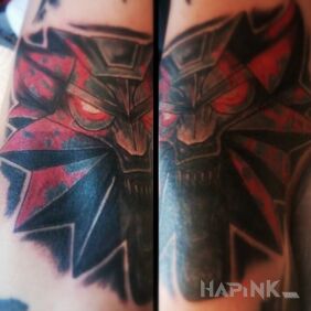 Tattoo The Witcher on the forearm motif: demons
